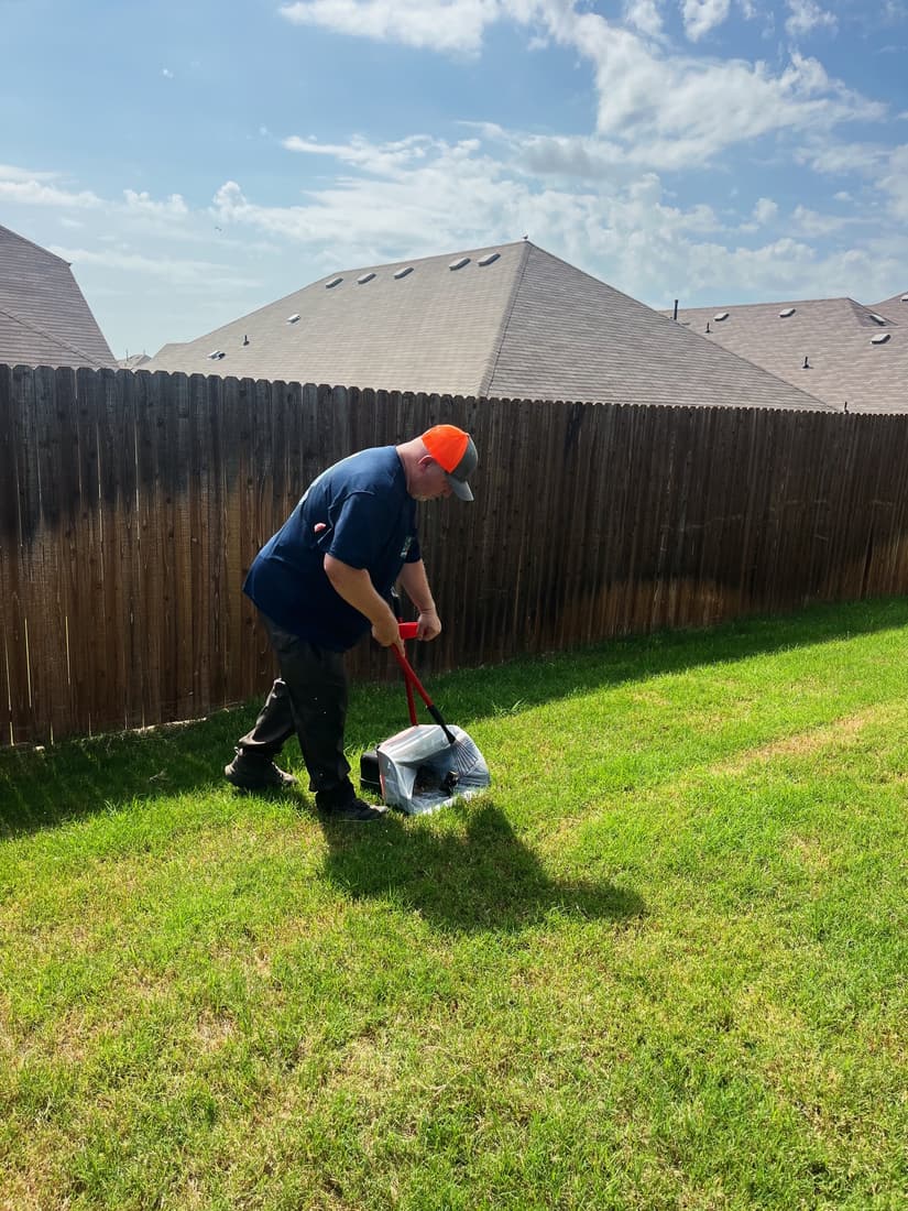 Paul working along a backyard fence line